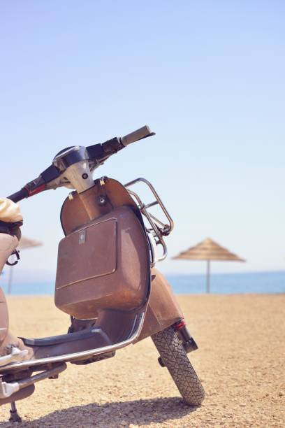 istock Vintage Motor Scooter Parked on Beach 157738136