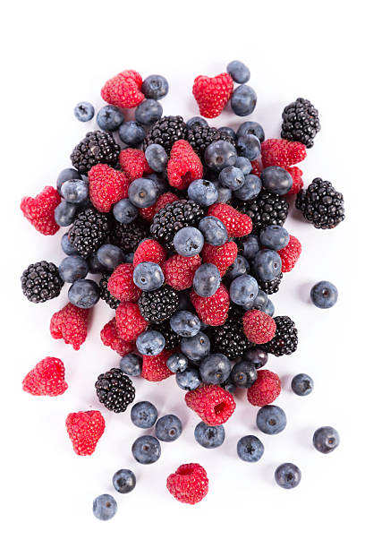 berries fresh forest fruits:  blueberries, rasberries and blackberries on white background berry fruit stock pictures, royalty-free photos & images