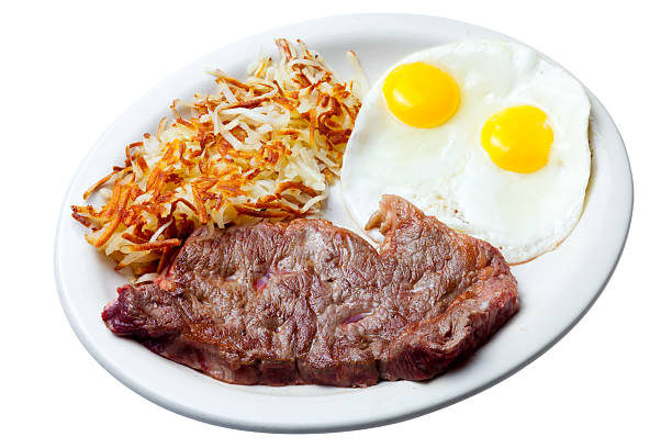 Steak, eggs sunnyside up and hashbrowns for breakfast  steak and eggs breakfast stock pictures, royalty-free photos & images