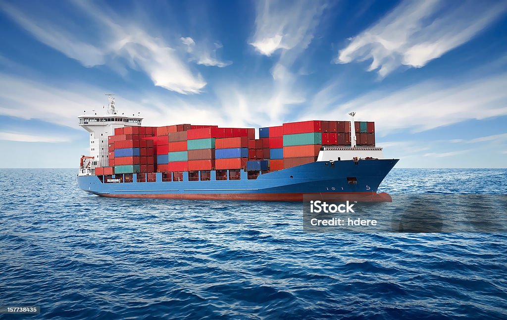 Container Ship A large container ship sailing along the coast. Container Ship Stock Photo