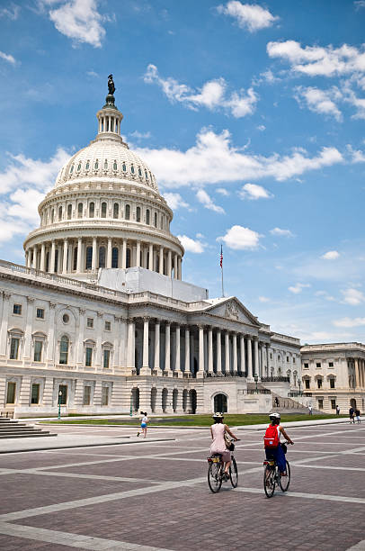 USA, Washington, DC, 07.04.2023 . White House with many happy tourists and a private lone Ukrainian protesting.