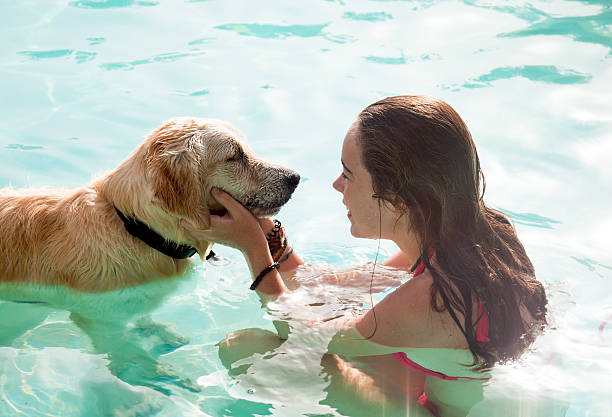 istock Girl and dog bathing in summer 157738803