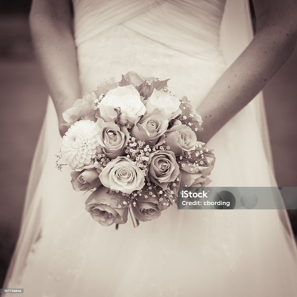 Vintage wedding bouquet Sepia toned photo of a bride holding a wedding bouquet Bouquet Stock Photo
