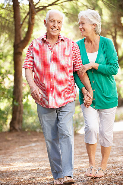 istock Senior Couple Walking In Countryside Together 157739094