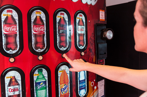 Hong Kong - January 25, 2022 : Coca-Cola Vending Machine in Wan Chai, Hong Kong. Vending machines are very convenient way of fast buying drinks on street.