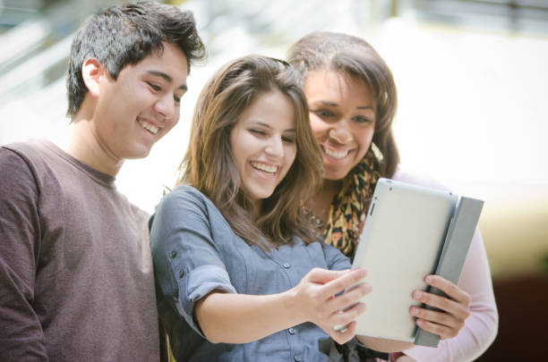 istock Smiling Group Of Friends With Digital Tablet 157739251