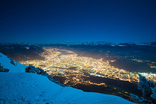 Grenoble Panorama in Winter Night Grenoble Panorama in Winter Night from a nearby mountain. isere river stock pictures, royalty-free photos & images