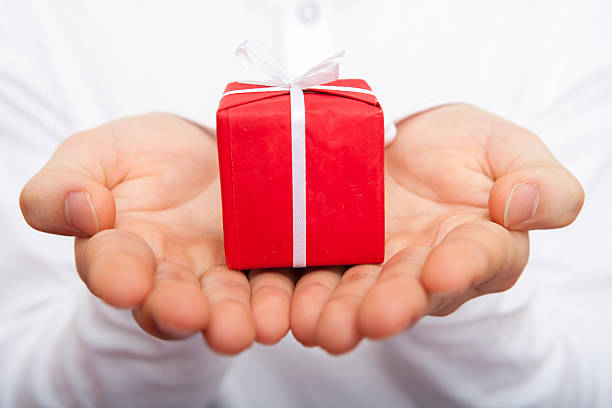 Male holding christmas present in palm