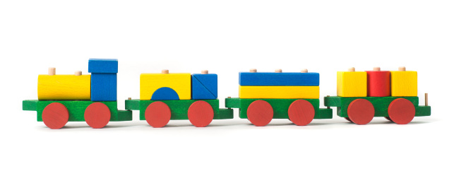 Wooden children's constructor-a steam train, isolated on a white background. Colorful toy train. Educational games for children. Design and modeling.