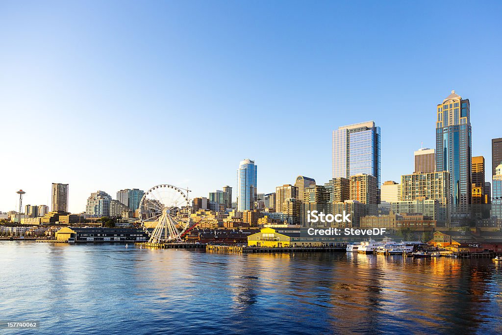 Seattle Downtown Waterfront with Space Needle and Great wheel Beautiful Seattle waterfront art sunset. Includes the Great Wheel ferris wheel which opened in the summer of 2012. Seattle Stock Photo