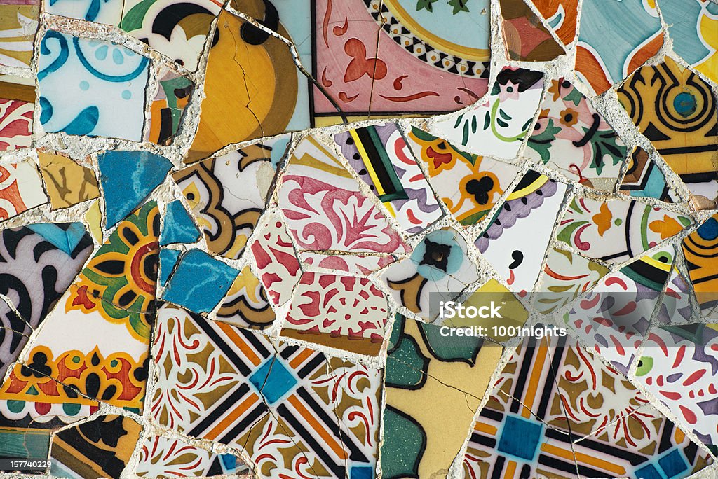 Mosaic of broken tiles Mosaic of broken tiles in the Parc Guell in Barcelona (Catalonia, Spain). The Parc Guell was designed by Antonio Gaudi and is declared as a World Heritage Site by the UNESCO. Barcelona - Spain Stock Photo