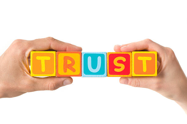 Trust in hands Human hand holding the word Trust bunt stock pictures, royalty-free photos & images