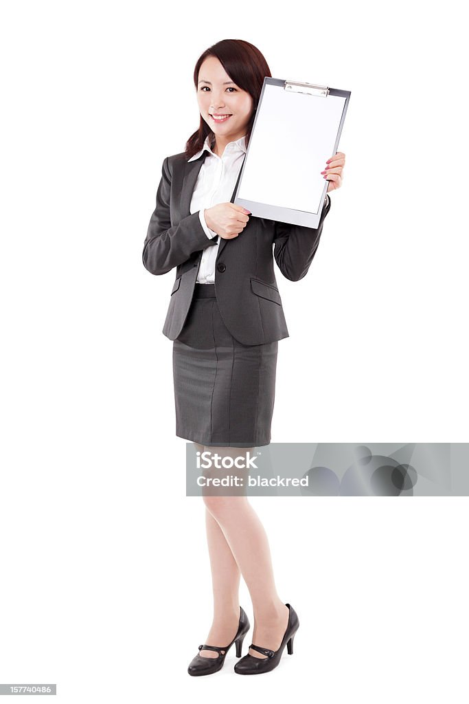 Asian Businesswoman with Blank Signage on White Background Young attractive Asian businesswoman presenting with a blank clipboard, isolated on white background. 30-39 Years Stock Photo