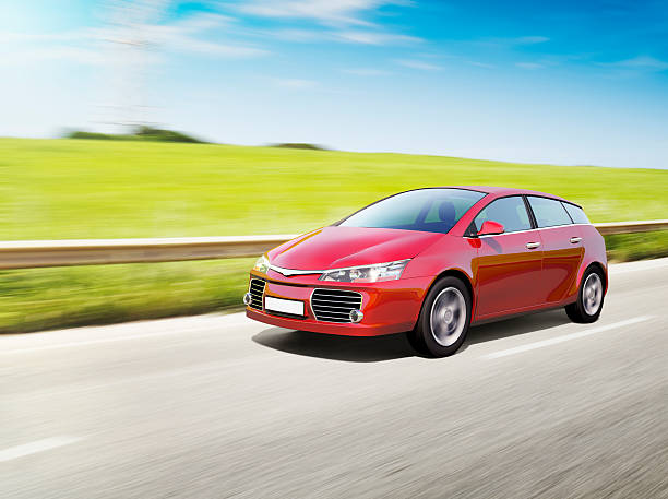Speeding red car Red compact car speeding on road. car-on-city-road-side-view stock pictures, royalty-free photos & images