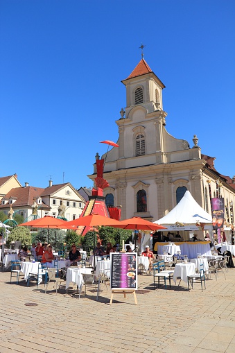 Ludwigsburg, Germany - September 8, 2012: The marketplace of Ludwigsburg on a wonderful sunny day in September 2012. Tourists sitting at a bar and are waiting fore the beginning of the Venetian Fair (Venetian Fair), a carnival event in honour of the Venetian Carnival in Italy.