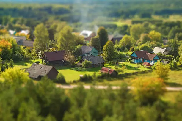 View to small village from high up, tilt shift technique, looks like miniature.