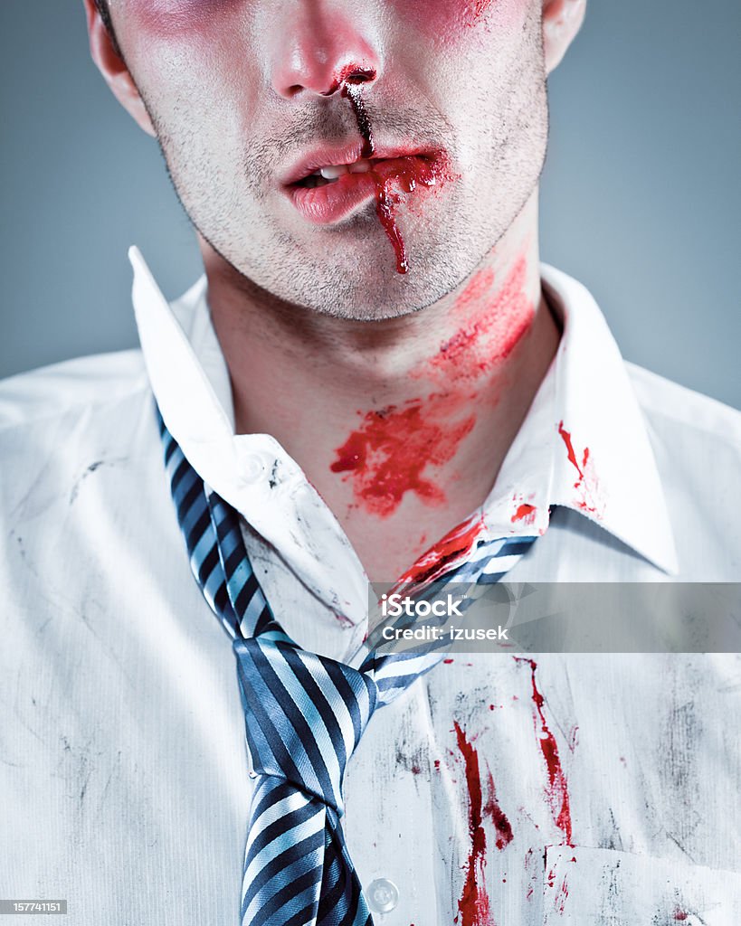 Injured businessman Portrait of young bloody businessman wearing shirt and tie. 25-29 Years Stock Photo