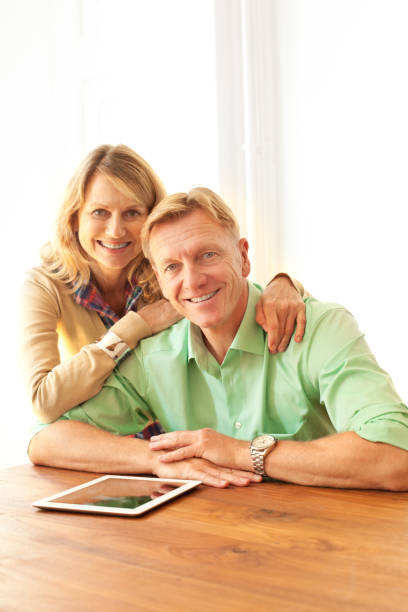 istock Mature couple with a digital tablet 157741417