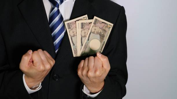 istock Businessman with banknotes in his pocket posing 1577415248