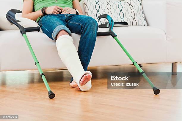 Man With Broken Leg At Home Stock Photo - Download Image Now - Broken Leg, Bone Fracture, Orthopedic Cast