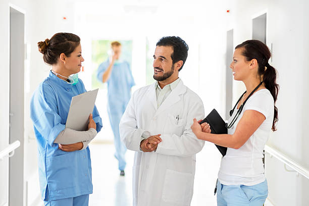 istock Doctors and nurse talking in hospital corridor 157742752