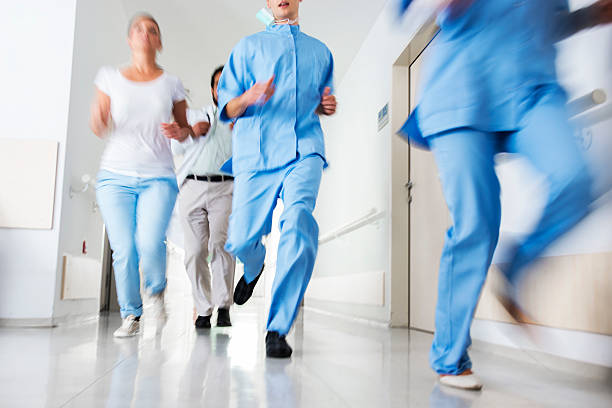 istock Doctors and nurses rushes for emergency in hospital corridor 157743100