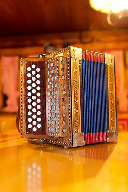 traditional Swiss accordion on table in mountain cabin