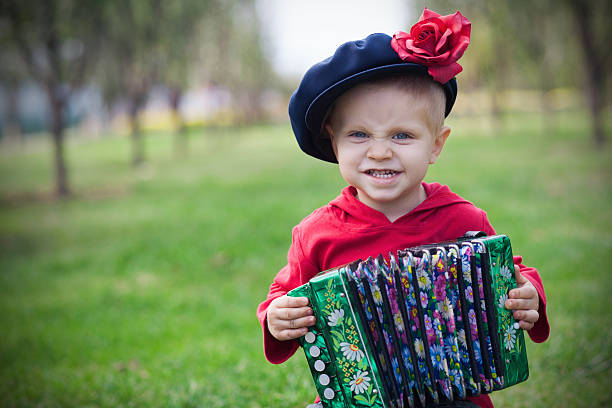 child with russian accordion - outdoors shoot