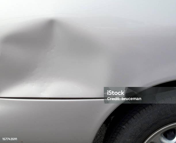 Closeup Of A Dent In A Gray Car Exterior Stock Photo - Download Image Now - Dented, Car, Bumper