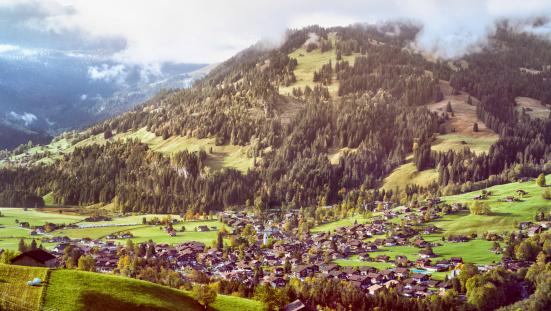 Lenk Im Simmental Village, built in a valley in Switzerland, shot from high altitude.