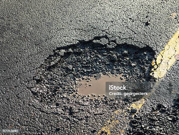 Dangerous Pot Hole On The Road Stock Photo - Download Image Now - Pot Hole, Road, UK
