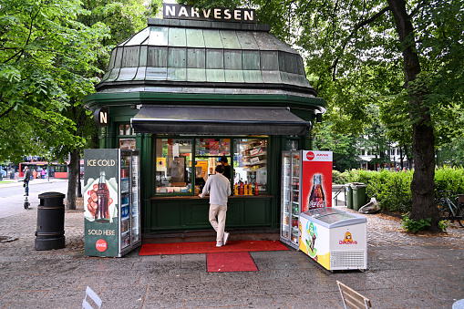 Oslo, Norway, July 4, 2023 - The historic Narvesen Kiosk at Eidsvolls Plass / Karl Johans Street in Oslo, built in 1914.