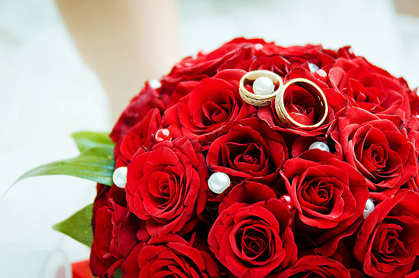 istock Wedding rings  on flowers 157748215
