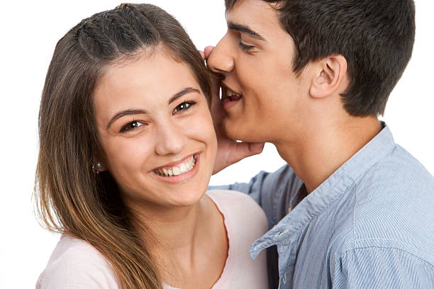 istock Boyfriend whispering secrets to girlfriend. 157748840