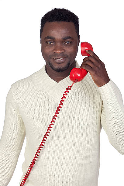 istock Attractive african man with a red phone 157751135