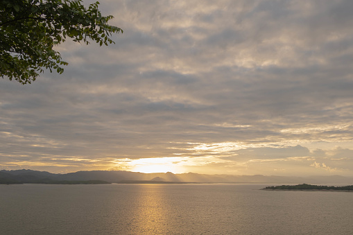 Travel for beautiful nature lake sunset, Relax vacation with landscape sky and evening sunlight, Calm outdoor holiday water reflection with cloud view background, peaceful calm horizon mountain