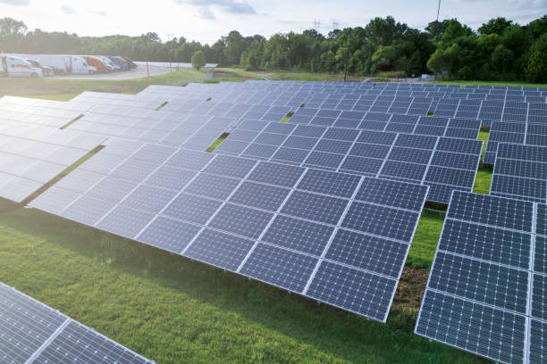 istock Solar panels on a field of grass 1577538958