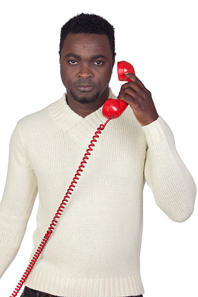 istock Attractive african man with a red phone 157760682