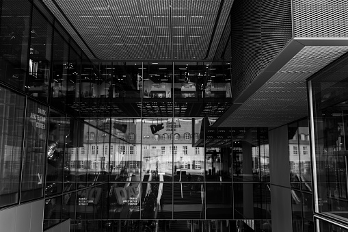 Copenhagen, Denmark - July 5, 2023: Reflection view around Danish Architecture Centre glass exterior.