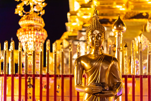 Chiang Mai, Thailand - January 8, 2022 : Wat Phra That Doi Suthep at night time is buddhist temple (wat) in Chiang Mai province. Within the site are pagodas, statues, bells, a museum, and shrines.