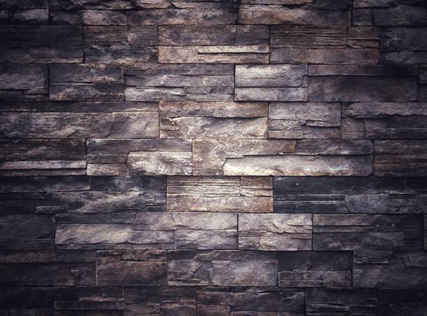 istock Old vintage retro style dark bricks wall for abstract brick background and texture. 1577692802