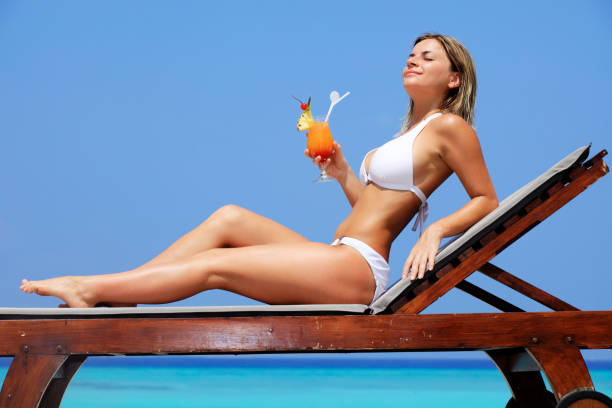 istock Lady with cocktail relaxing on a exotic resort. 157770037