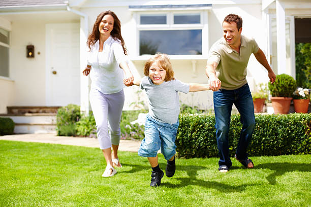 istock Playful little boy with his parents having fun on grass 157770038