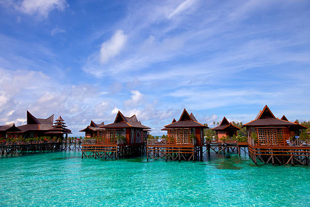 Houses upon stilts in water village on Mabul Island Malaysia Mabul island is the "base camp" for the most of the divers on Sipadan island, one of the top world's diving place. Mabul is also know as one of the best muck diving site. mabul island stock pictures, royalty-free photos & images