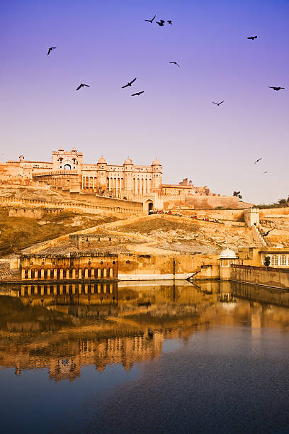 Amber Fort Rajasthan State India Amber Fort is a well-known fort near Jaipur, Rajasthan state, India. It is known for its unique artistic style, blending both Hindu and Muslim (Mughal) elements, and its ornate and breathtaking artistic mastery.  jaipur stock pictures, royalty-free photos & images
