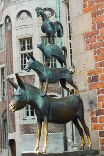 Town Musicians of Bremen: Die Bremer Stadtmusikanten. Statue based on folktale recorded by the Brothers Grimm. This bronze statue was built by Gerhard Marcks in 1953 and dedicated to town Bremen and folktale. It is loctaed at westside of city hall.