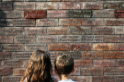 Liverpool, England - April 12, 2007: Two children looking at the Cavern Wall of Fame