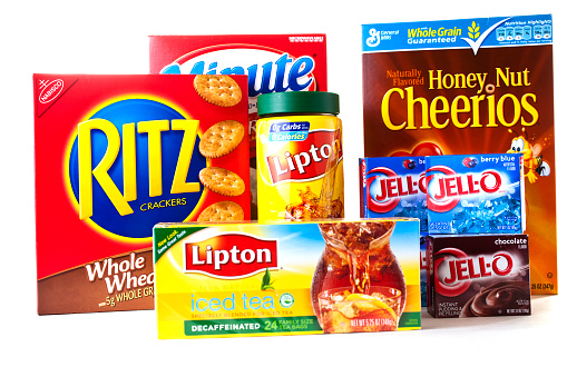 Conroe, TX, USA - December 14, 2011:  Colorful packaging of a variety of food products.  Ritz crackers, Lipton tea, Jell-o, Cheerios, and Minute Rice.