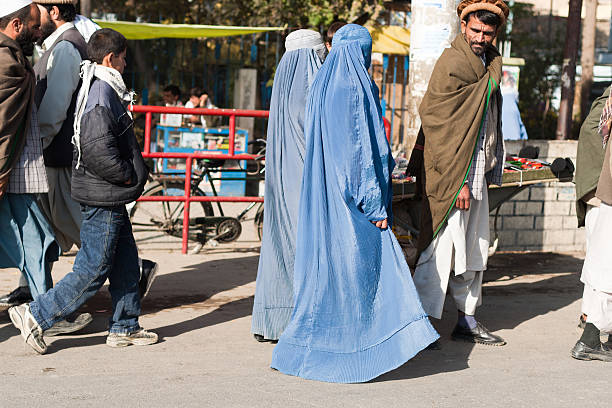Afghan man and his two wifes stock photo