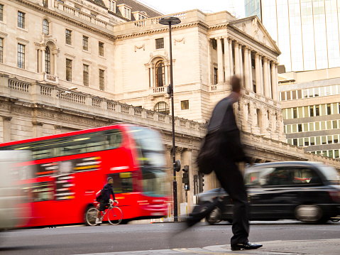 London, England, UK - August 14, 2023: London Financial district on a rainy day in August 2023. In the background is the Royal Exchange and on the left The Bank of England. The statue is of Wellington. London, England, UK.